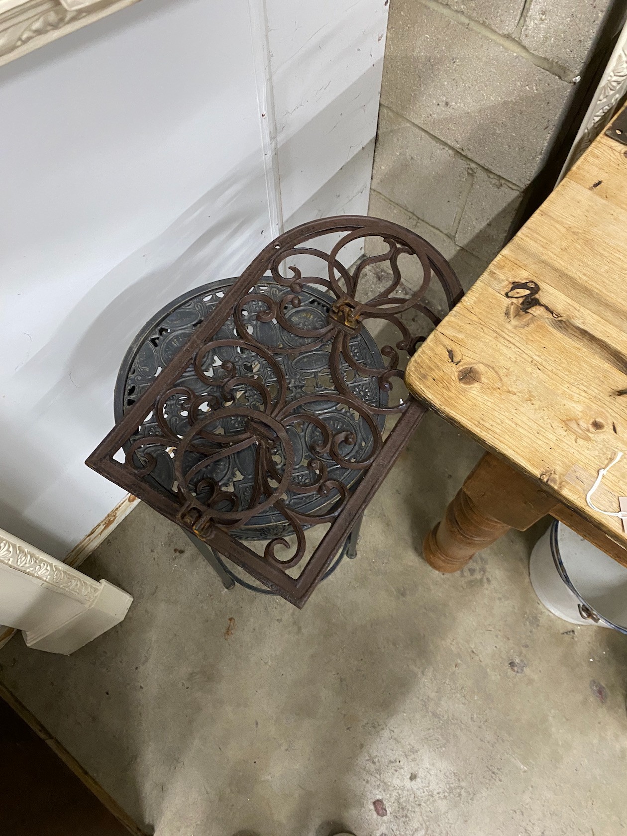 Three metal hanging baskets, a wall mounted pot holder and a stand
